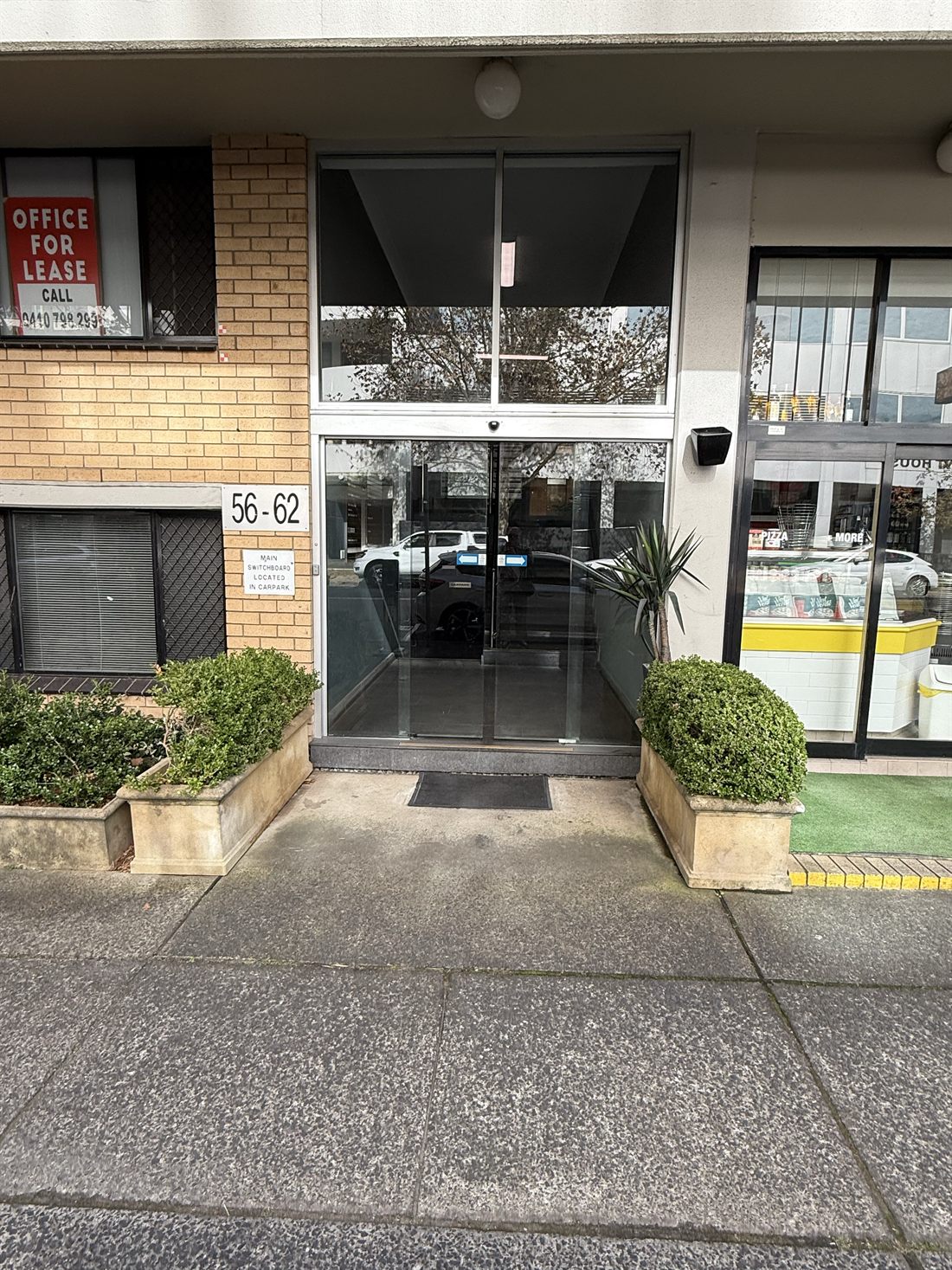 French Studio building entrance at 56-62 Chandos Street, next to Pizza D'Oro